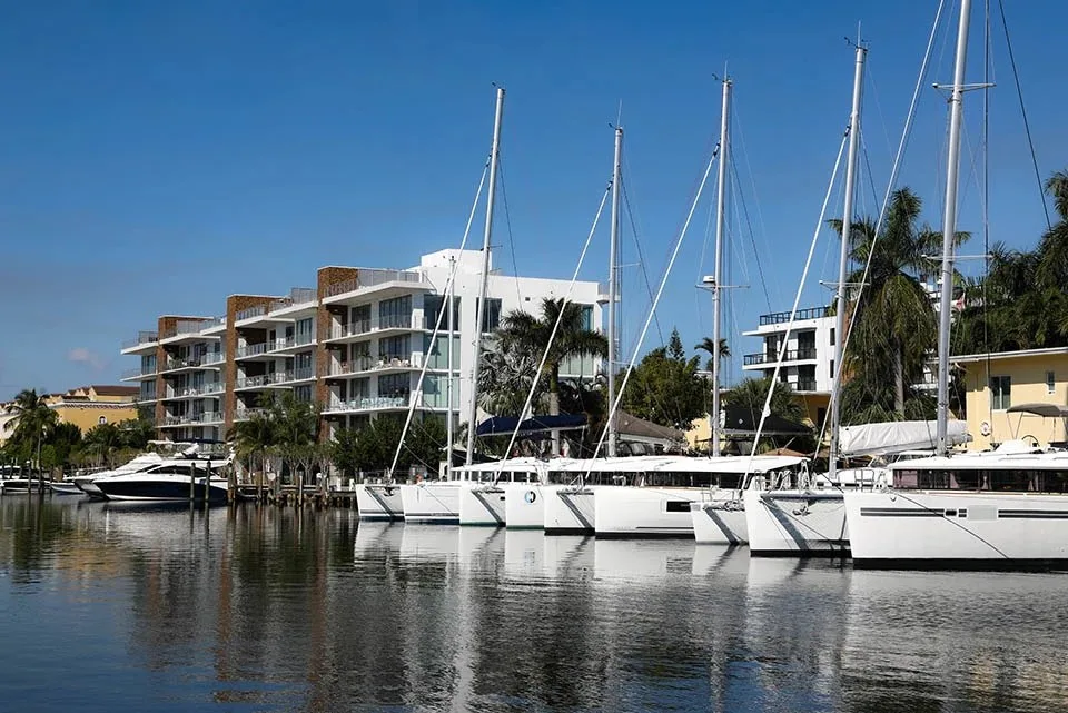 Sailboats docked at a marina near Las Olas Isles