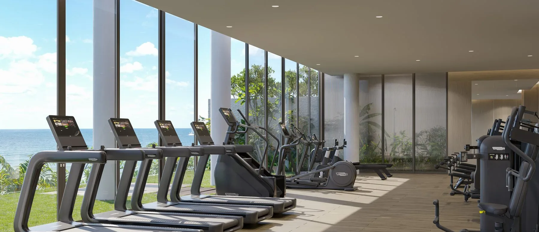 Oceanfront fitness center at Rosewood Residences